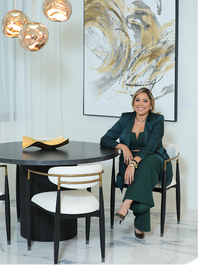 Zamira Ariza in the completed designer kitchen at Flaava House showcasing modern luxury interior design and custom cabinetry.