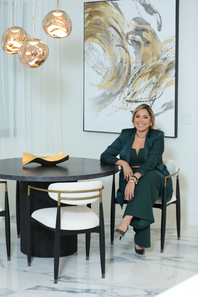 Zamira Ariza in the completed designer kitchen at Flaava House showcasing modern luxury interior design and custom cabinetry.
