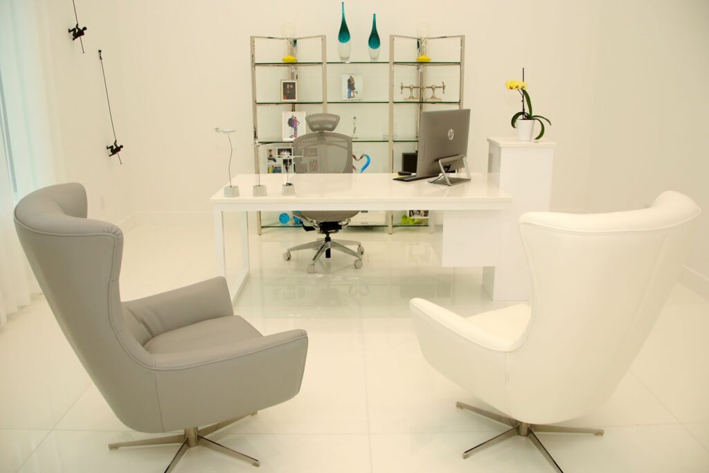 Contemporary executive home office with custom furnishings and minimalist design at Canvas Sur in Windermere, Florida.