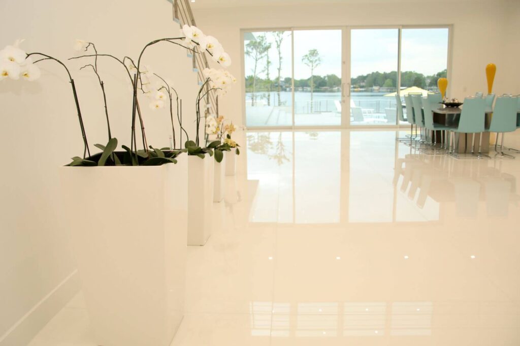 Expansive entrance to the great room overlooking the lake with contemporary architecture and designer furnishings at Canvas Sur.