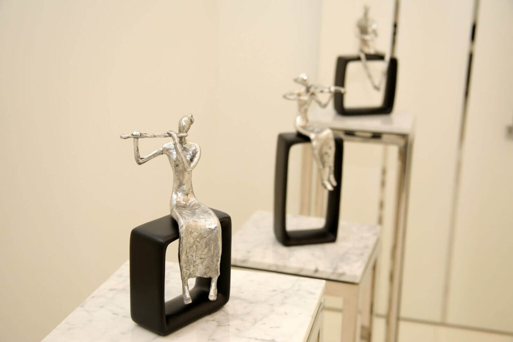 Contemporary decorative sculptures displayed throughout Canvas Sur luxury residence in Windermere, Florida.
