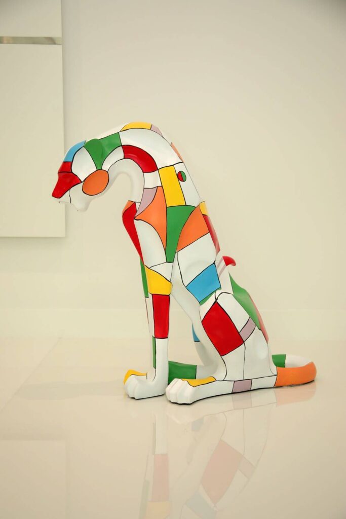 Contemporary geometric dog sculpture displayed inside Canvas Sur luxury lakefront residence in Windermere, Florida.