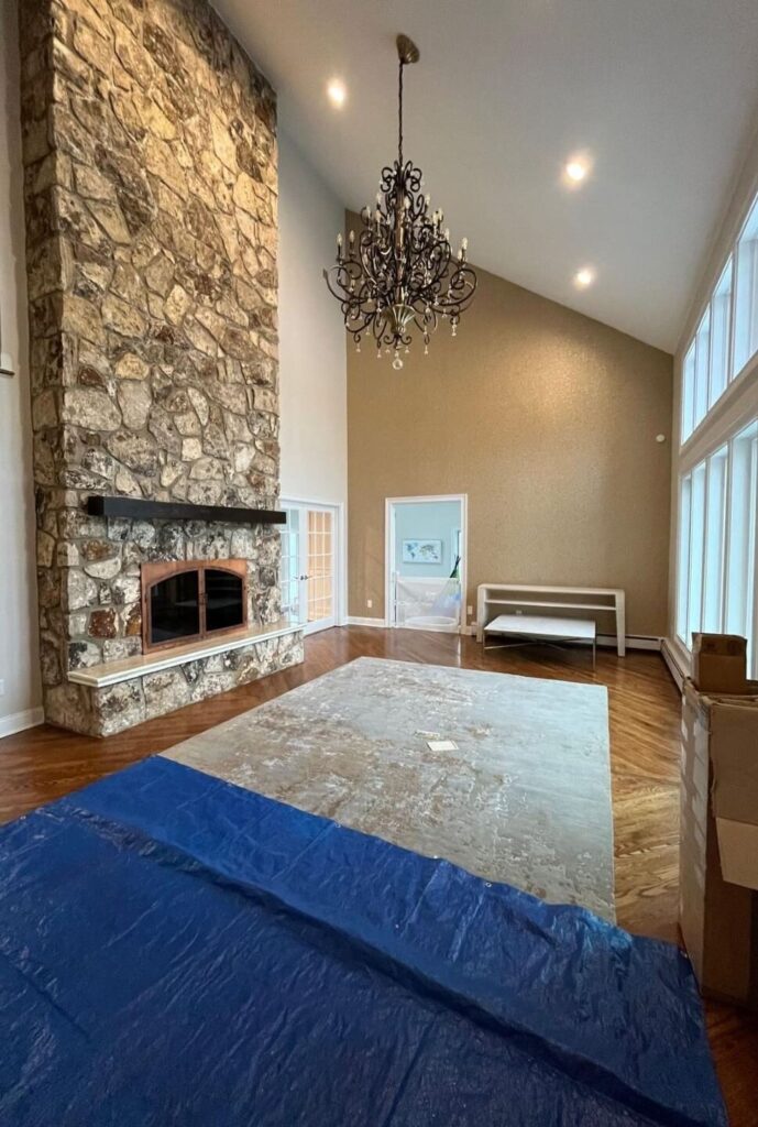 Before photo of the double-height living room prior to furnishing and interior styling in a traditional North Caldwell residence.